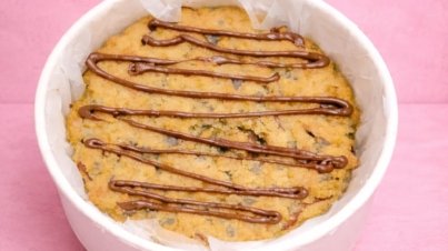 Cookie Pie with chocolate-filled center, soft and chewy texture, topped with golden brown crust