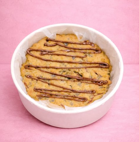 Cookie Pie with chocolate-filled center, soft and chewy texture, topped with golden brown crust